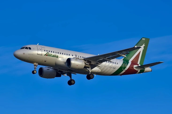 white and green plane during daytime